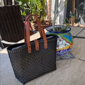 Artesian Black Woven bag with Brown leather handles. It’s beautiful